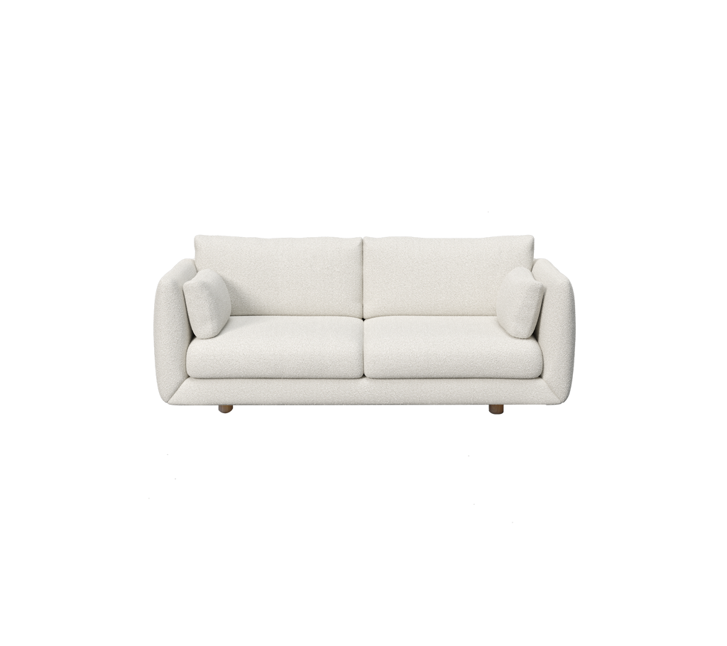 Moderne hvid sofa med to puder.