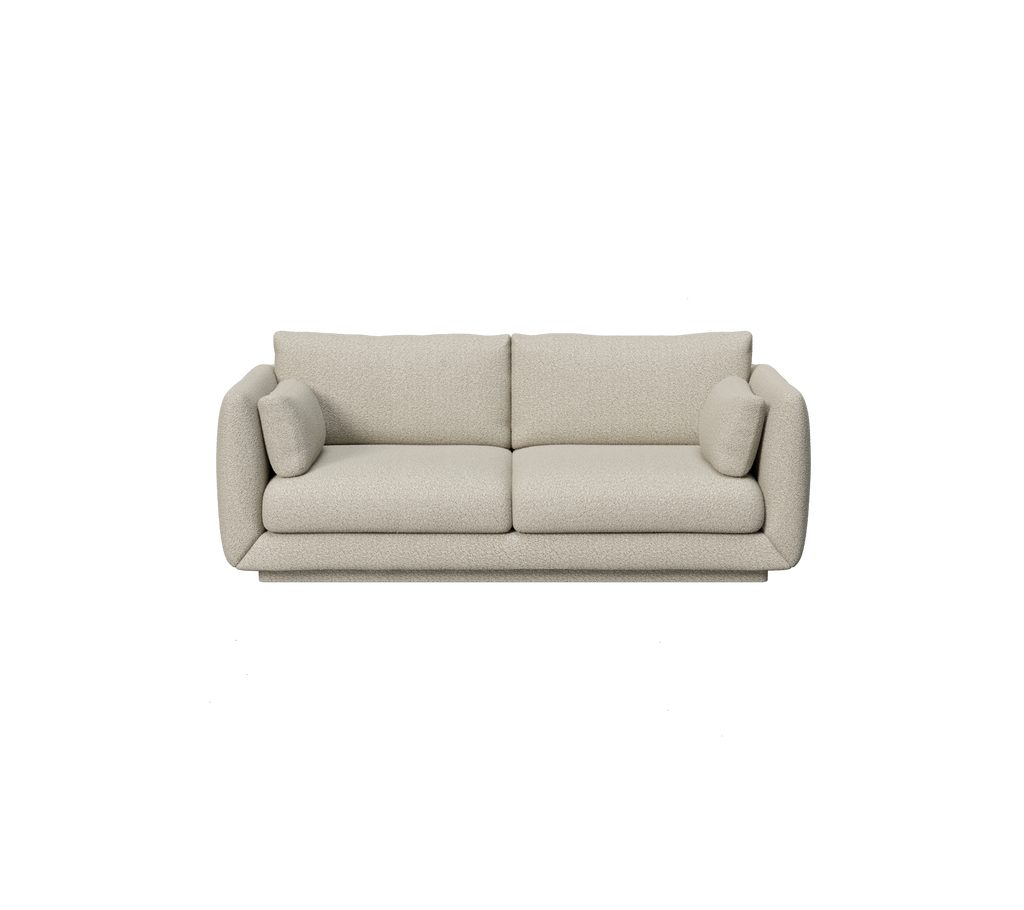 Lysbrun sofa med runde puder i et moderne design.