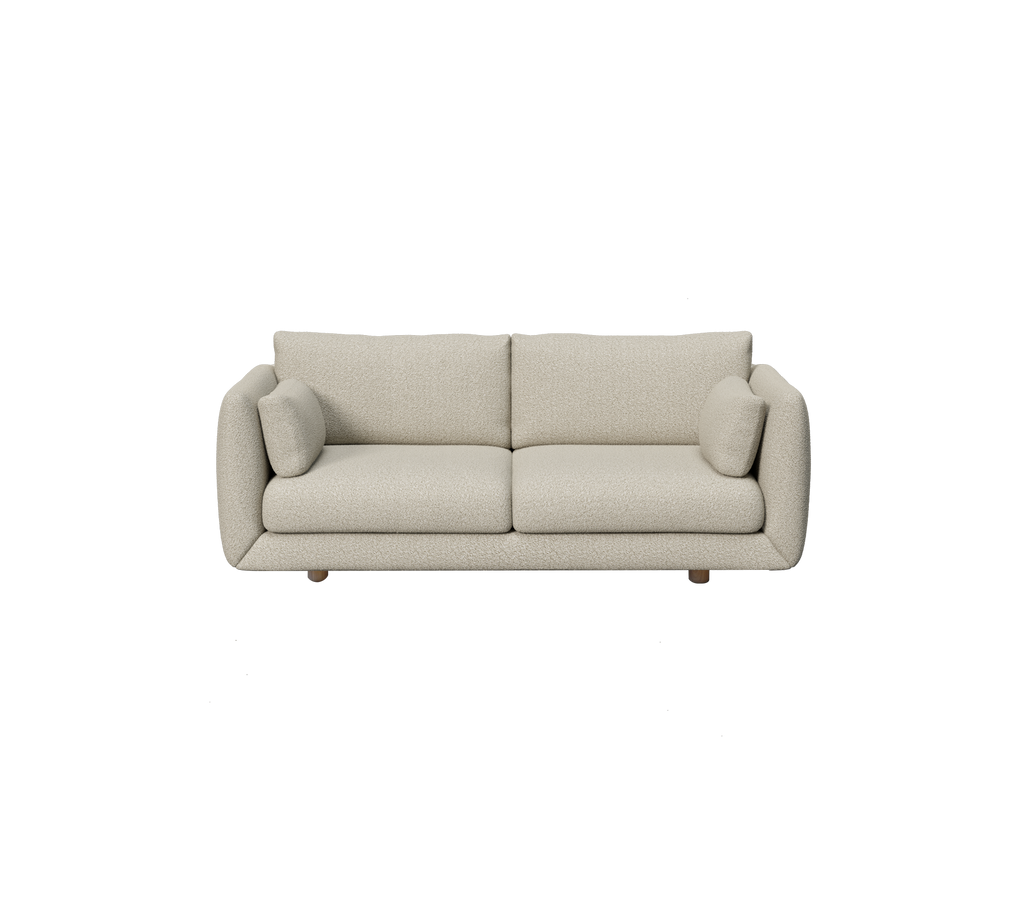Lysbrun moderne sofa med runde puder i en minimalistisk stil.