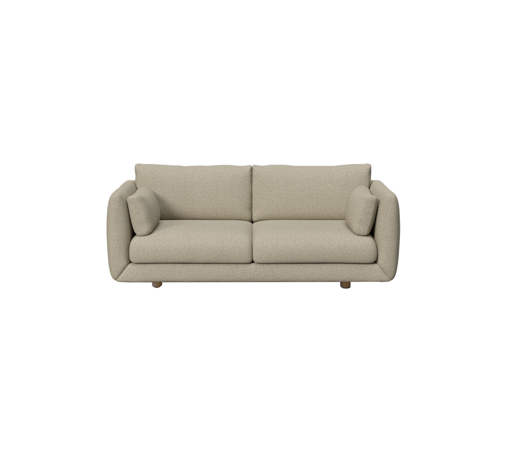 Moderne brun sofa med rundede puder i en loungeindstilling.