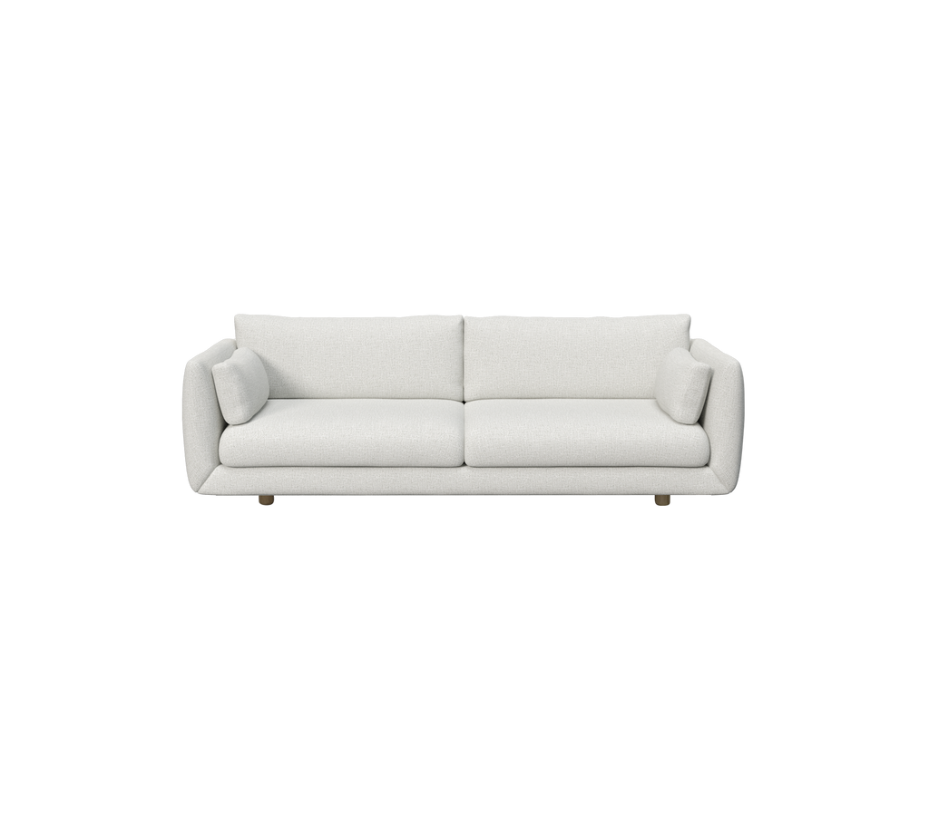 Lys grå moderne sofa med minimalistisk design.