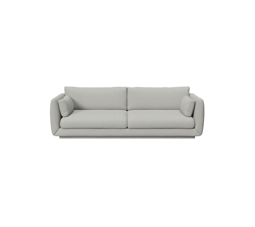 Lysegrå moderne sofa med runde puder.