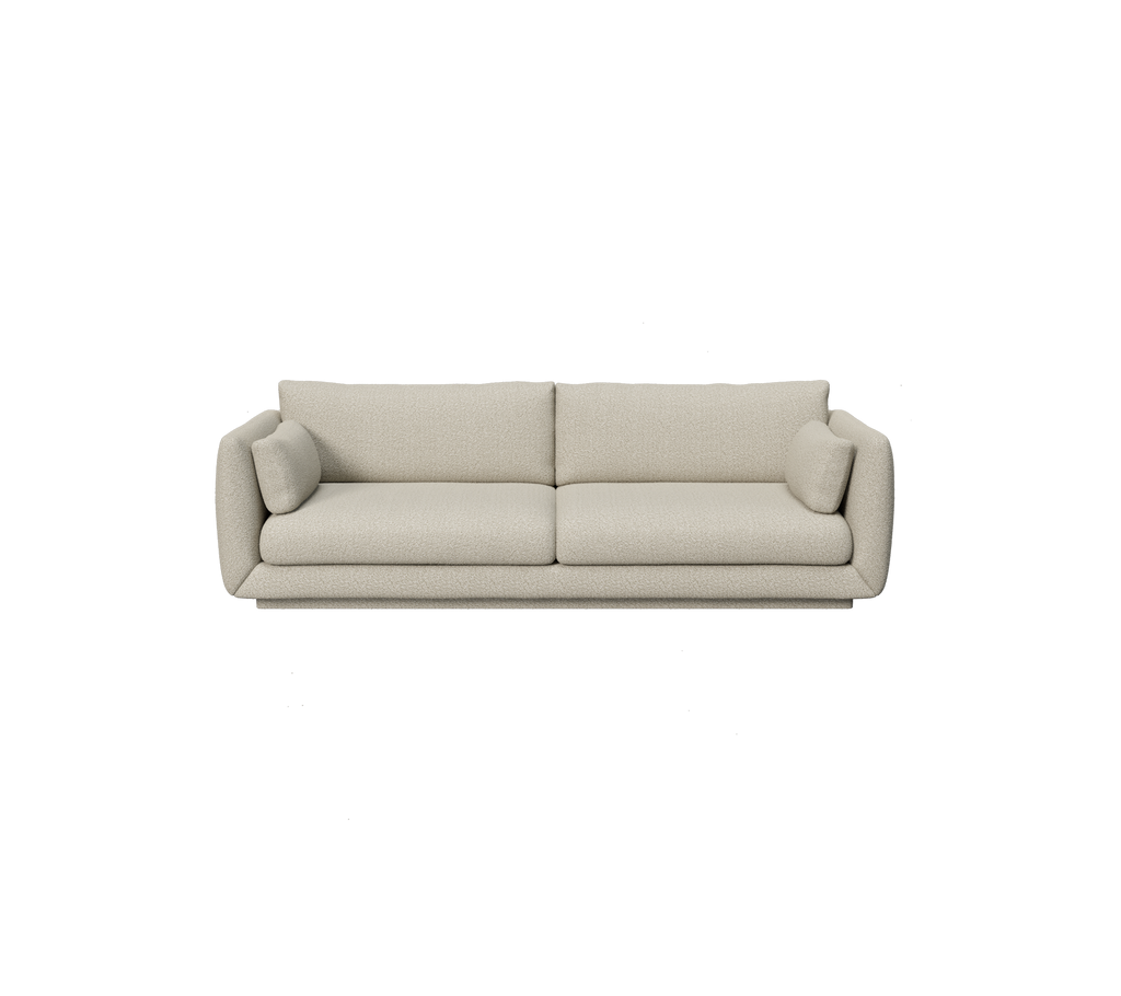 Lysbrun moderne sofa med afrundede kanter og puder.