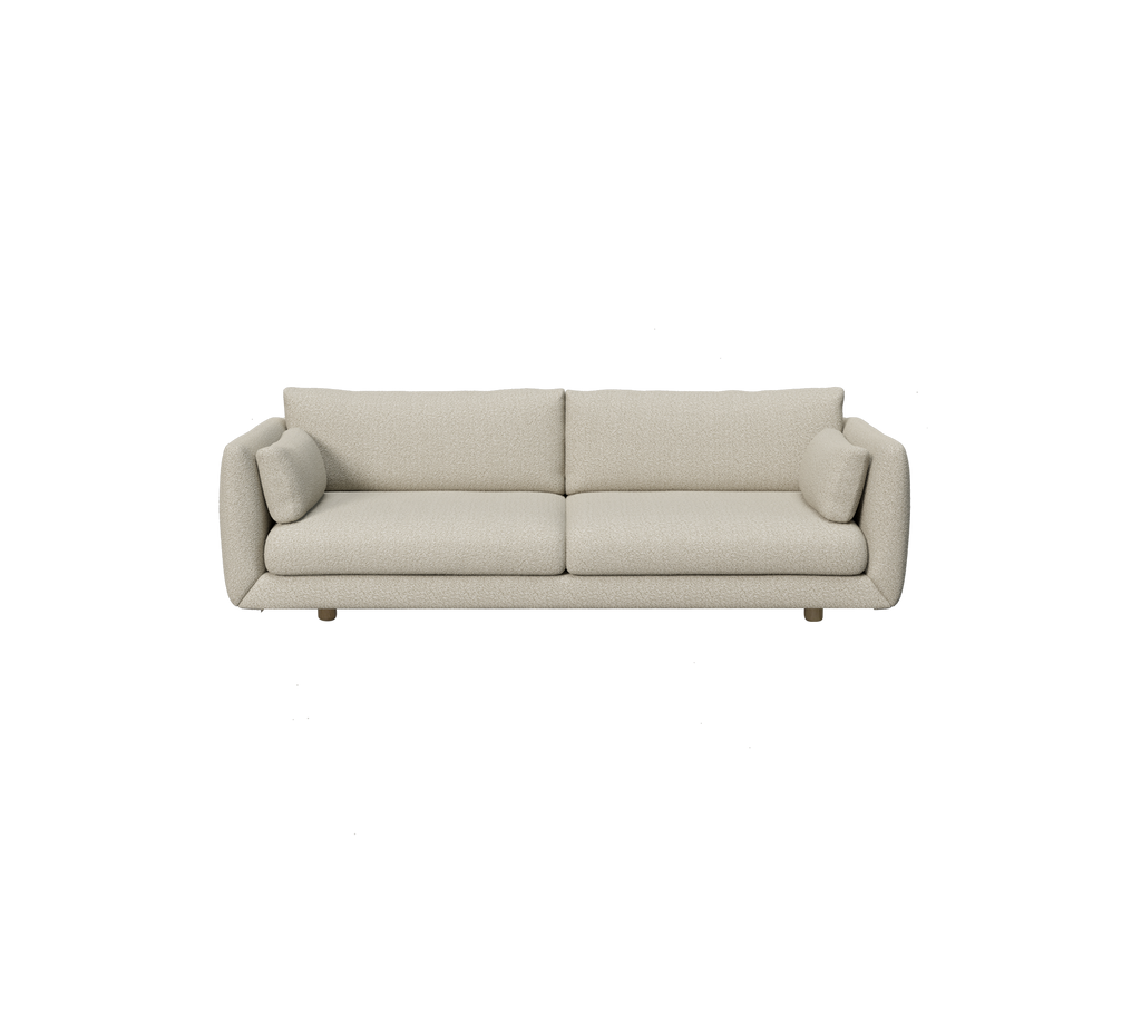 Moderne lysebrun sofa med rundede puder i et minimalistisk design.