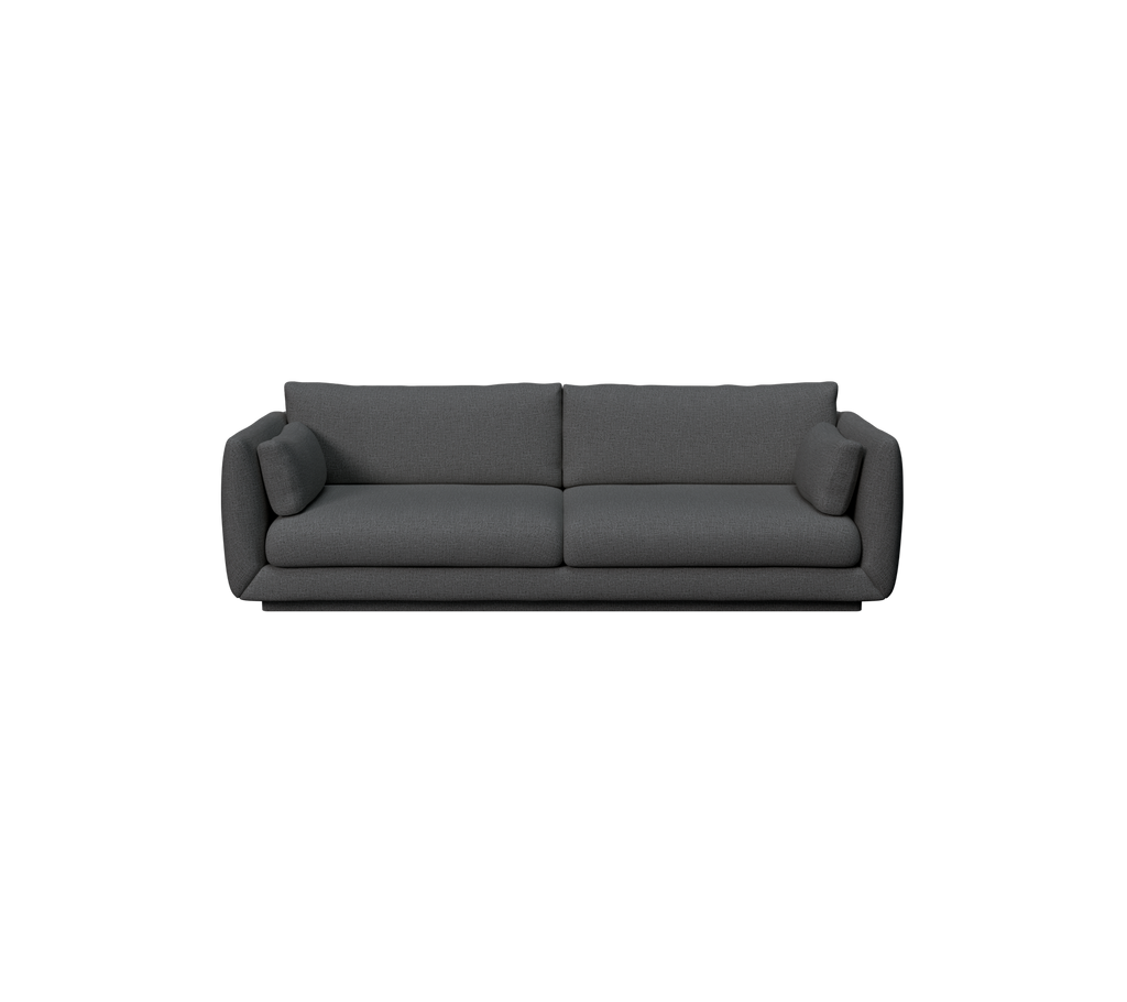 Moderne mørkegrøn sofa med et strømlinet design og komfortable puder.