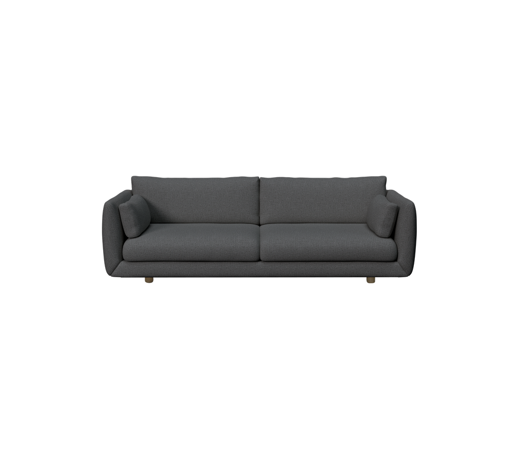 Mørkegrøn moderne sofa med bløde puder.