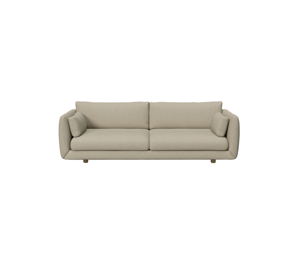 Brun moderne sofa med runde pude i et nutidigt miljø.