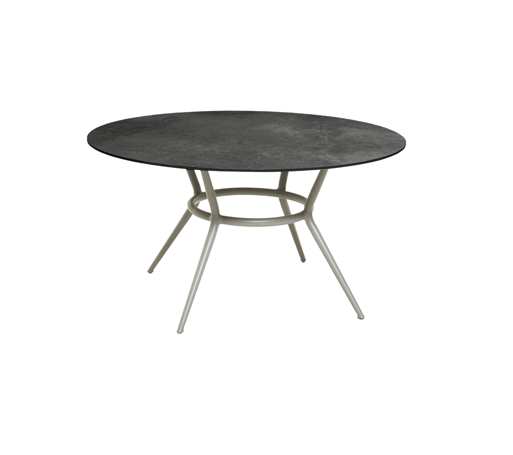 Rund mørkegrå bord med et minimalistisk design og lyse ben.