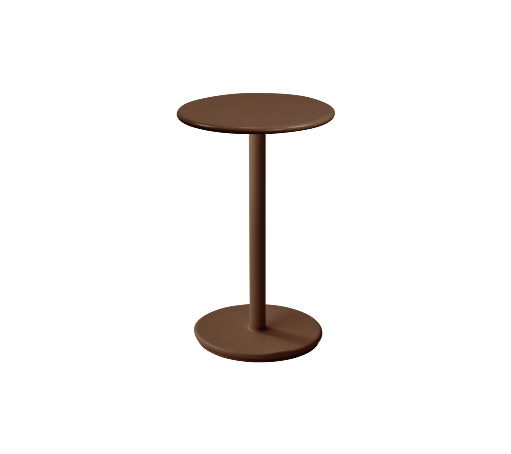 Moderne rundt bord i ørkenrød farve.