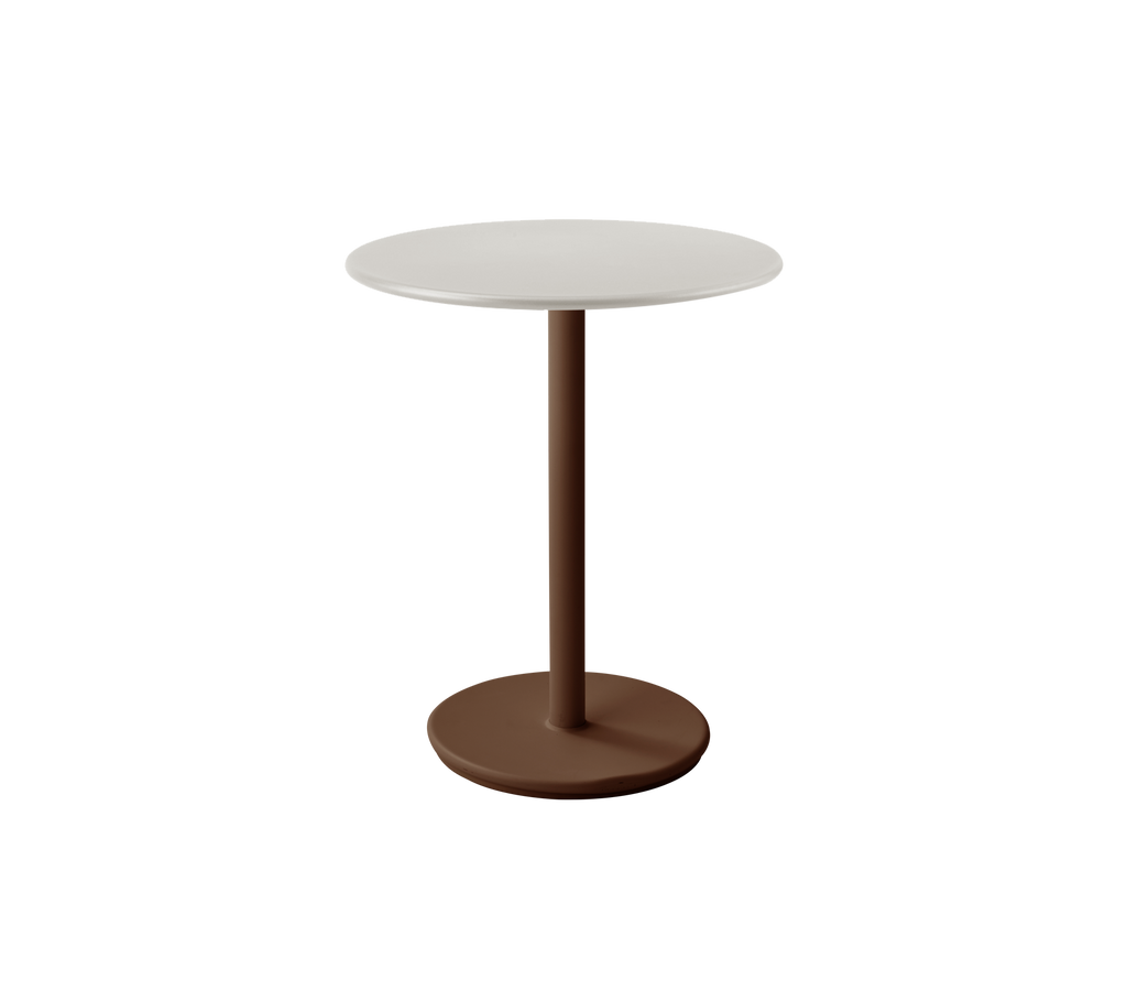 Moderne hvidt bord med ørkenrød base i et stilfuldt lounge-miljø.