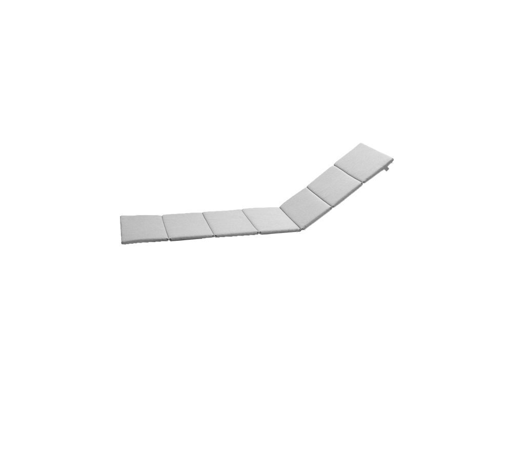 Rektangulær, flad overflade med flere sammenkoblede segmenter, der skaber en let kurve for alsidig placering og brug.