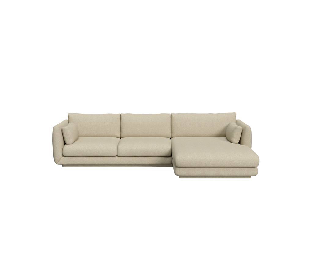 Lysbrun sectional sofa i et moderne lounge-område.