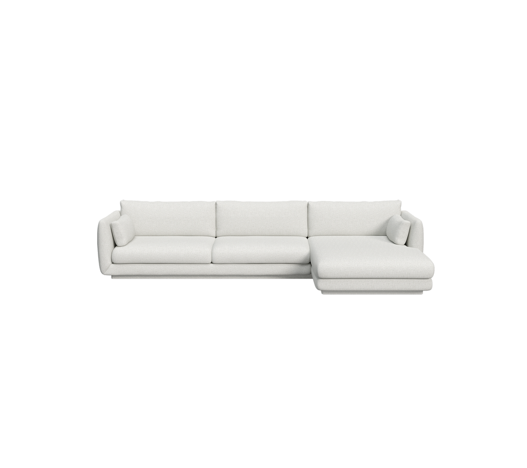 Lys grå moderne sofa med en sektionel design.