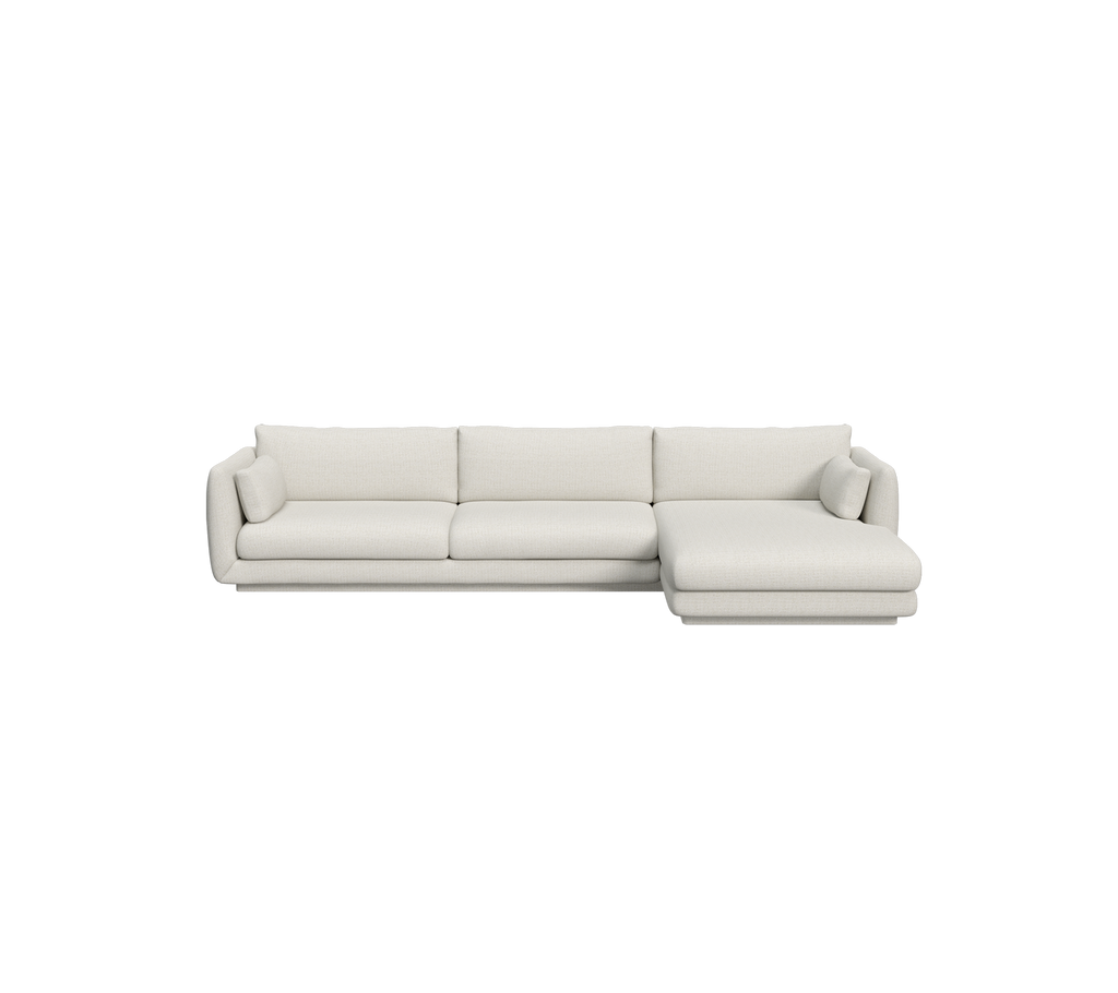 Moderne sandfarvet sektionel sofa med rene linjer og rummelig siddeplads.
