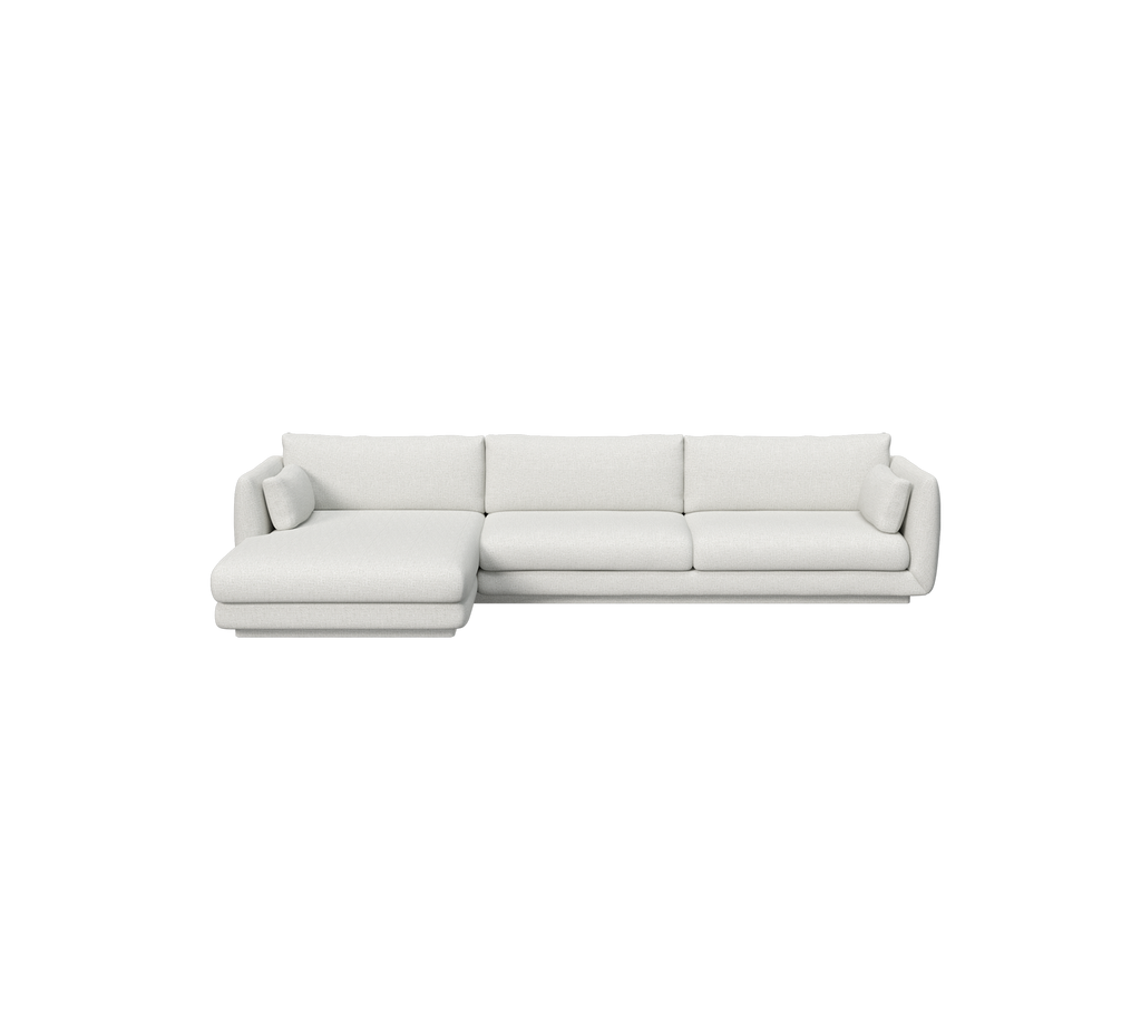 Lys grå sektion sofa i en moderne loungeindstilling.