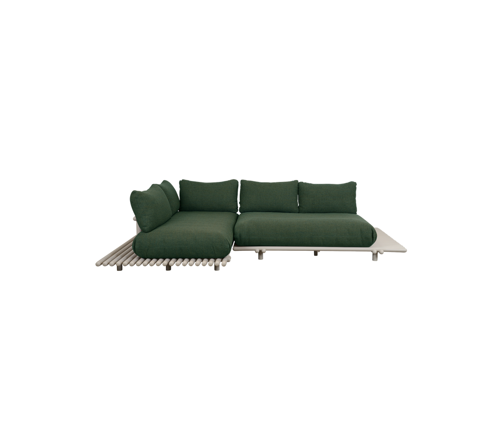Moderne mørkegrøn sofa med et minimalistisk design.